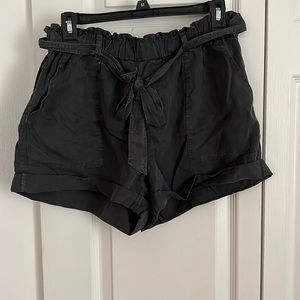 Medium navy/dark wash front tie shorts. With elastic waistband.